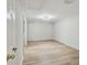 Empty bedroom showing modern wood-look floors and neutral paint at 4209 Westwood Dr, Holiday, FL 34691