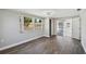 Bedroom with hardwood floors, and a view of the backyard through the windows at 4209 Westwood Dr, Holiday, FL 34691