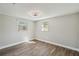 Bedroom featuring neutral colors, modern flooring and plenty of natural light at 4209 Westwood Dr, Holiday, FL 34691