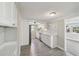 Modern kitchen with white cabinets, sleek countertops, and stainless steel appliances, offers a contemporary design at 4209 Westwood Dr, Holiday, FL 34691