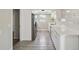 Well-lit kitchen features white cabinets, stainless steel appliances, and tile flooring, perfect for cooking at 4209 Westwood Dr, Holiday, FL 34691