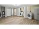 Spacious laundry area with washer, dryer, storage and wood-look floors at 4209 Westwood Dr, Holiday, FL 34691