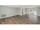 Spacious living room with modern flooring, neutral walls, and recessed lighting at 4209 Westwood Dr, Holiday, FL 34691