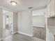 Bright room with hardwood floors, neutral walls, and a view to another room at 4209 Westwood Dr, Holiday, FL 34691