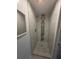 Walk-in shower features contemporary tiling and modern fixtures at 4209 Westwood Dr, Holiday, FL 34691
