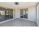 Sunroom boasts tiled floors, sliding glass doors and backyard views at 4209 Westwood Dr, Holiday, FL 34691