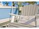 Comfortable Adirondack chair with Treasure Island, FL pillow, perfect for relaxing by the water at 440 Capri Blvd, Treasure Island, FL 33706