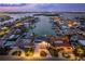 Breathtaking aerial view of a waterfront community, showcasing luxurious homes with private docks and stunning canal views at 440 Capri Blvd, Treasure Island, FL 33706