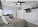 Comfortable bedroom with neutral walls, television, and ample lighting at 440 Capri Blvd, Treasure Island, FL 33706