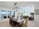 Dining room with water views that opens up to the living room with cathedral ceilings at 440 Capri Blvd, Treasure Island, FL 33706