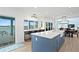 Open concept kitchen with an eat-in breakfast bar overlooking the water and stainless steel appliances at 440 Capri Blvd, Treasure Island, FL 33706