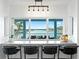 Kitchen breakfast bar with views of water, barstool seating and modern pendant lighting at 440 Capri Blvd, Treasure Island, FL 33706