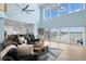 Open concept living room with cathedral ceilings, water views, and hardwood floors at 440 Capri Blvd, Treasure Island, FL 33706