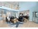Spacious living room featuring an upstairs loft, water views, and an open floor plan at 440 Capri Blvd, Treasure Island, FL 33706