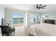 Bright main bedroom with waterfront views, comfortable seating area, and large closet space at 440 Capri Blvd, Treasure Island, FL 33706