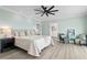 Serene main bedroom includes a cozy seating area and an en-suite bathroom with double vanities at 440 Capri Blvd, Treasure Island, FL 33706