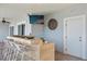 Outdoor bar features stone accents, seating for six and a wall mounted television for entertaining at 440 Capri Blvd, Treasure Island, FL 33706