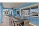 Outdoor dining area on the patio with seating for eight and views of the water at 440 Capri Blvd, Treasure Island, FL 33706