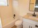 The bathroom features a granite counter, a bathtub and shower combination, and updated fixtures at 4517 100Th N Ave, Pinellas Park, FL 33782
