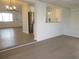 Bright living room featuring lots of natural light and light wood colored vinyl flooring at 4517 100Th N Ave, Pinellas Park, FL 33782