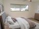 The owner's suite is furnished with a bed, dresser, and decorative art on the walls at 4517 100Th N Ave, Pinellas Park, FL 33782