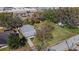 Aerial view of the home and lot, showcasing proximity to a shopping center at 4814 Edmund Ct, Dover, FL 33527