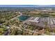 A high aerial view of the home near a commercial business and pond at 4814 Edmund Ct, Dover, FL 33527