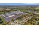 Aerial view showcases the home near a commercial business and highway at 4814 Edmund Ct, Dover, FL 33527