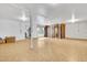 Large unfinished basement area features concrete support beams, vinyl flooring, and bright lighting at 4814 Edmund Ct, Dover, FL 33527