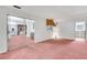 Open living space with glass sliding door and connecting rooms, perfect for entertaining guests at 4814 Edmund Ct, Dover, FL 33527