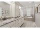 Bathroom featuring and sinks, white cabinets, granite countertops, and bathtub at 518 33Rd N Ave, St Petersburg, FL 33704