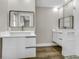 Bright bathroom featuring dual vanities, modern fixtures, and a glass shower at 525 Lamara Ne Way, St Petersburg, FL 33704