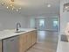 Bright kitchen with stainless steel appliances and a kitchen island and an open floor plan at 525 Lamara Ne Way, St Petersburg, FL 33704