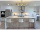 Well-lit kitchen featuring modern stainless steel appliances, a central island, and ample countertop space at 525 Lamara Ne Way, St Petersburg, FL 33704