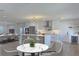 Open-concept kitchen featuring a large center island, stainless steel appliances, and modern lighting at 525 Lamara Ne Way, St Petersburg, FL 33704