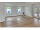 Bright living room featuring hardwood floors, bright windows and glass doors to the exterior at 525 Lamara Ne Way, St Petersburg, FL 33704