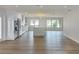 Spacious living room with an open floor plan, bright windows and hardwood floors at 525 Lamara Ne Way, St Petersburg, FL 33704