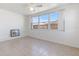 Bright bedroom with neutral tile flooring and large windows providing natural light at 5313 Mosaic Dr, Holiday, FL 34690