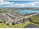 An aerial view of the community highlighting homes and scenic lake at 5955 Sweet Birch Dr, Riverview, FL 33578