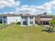 A large, fenced backyard with green grass and an open view at 5955 Sweet Birch Dr, Riverview, FL 33578