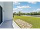 Enjoy a backyard with a lake view from this home, with lush green grass at 5955 Sweet Birch Dr, Riverview, FL 33578