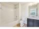 Clean bathroom with tub/shower combo, modern fixtures, and a sleek vanity at 5955 Sweet Birch Dr, Riverview, FL 33578