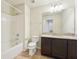 Full bathroom featuring granite vanity top, ceramic tile flooring, and bathtub at 5955 Sweet Birch Dr, Riverview, FL 33578