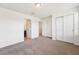 Bedroom with neutral carpeting, closet, and access to bathroom at 5955 Sweet Birch Dr, Riverview, FL 33578