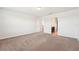 Bright bedroom with carpet flooring and a door to an ensuite bathroom at 5955 Sweet Birch Dr, Riverview, FL 33578