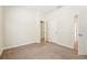 Bedroom with an open door, leading into another room in the house at 5955 Sweet Birch Dr, Riverview, FL 33578