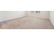 Bright bedroom with carpet, two windows allowing natural light, and neutral wall color at 5955 Sweet Birch Dr, Riverview, FL 33578