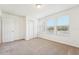 Spacious bedroom with large windows, closet and neutral carpeting at 5955 Sweet Birch Dr, Riverview, FL 33578