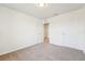 Bright bedroom featuring carpet flooring and an adjoining walk-in closet at 5955 Sweet Birch Dr, Riverview, FL 33578