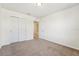 Bedroom featuring carpeting, a closet, and interior door to another room at 5955 Sweet Birch Dr, Riverview, FL 33578